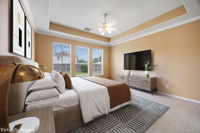 an empty room with a ceiling fan and a window