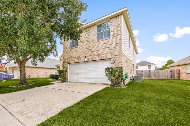 a view of an empty room with glass door and wooden floor