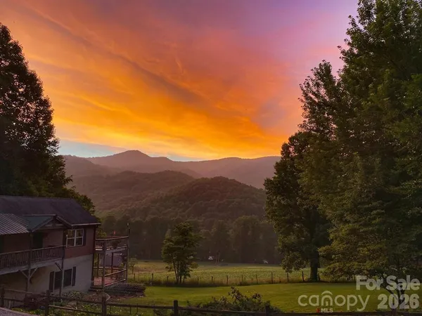 a view of a town with mountains in the background