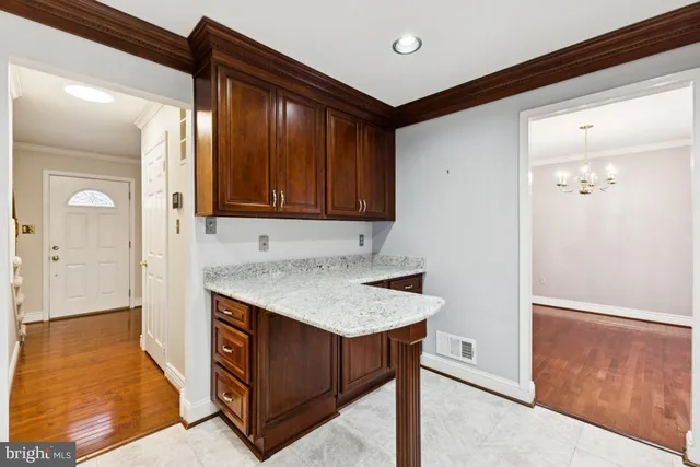 a view of kitchen island with cabinets