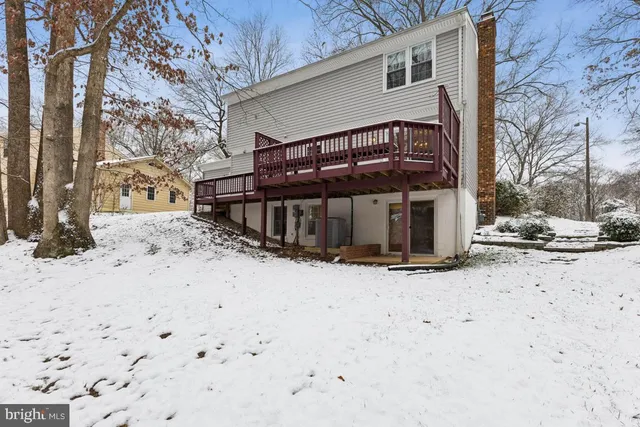 a view of a house with snow on the road