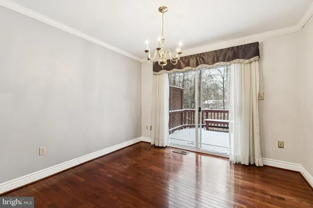 a view of a room with wooden floor and balcony