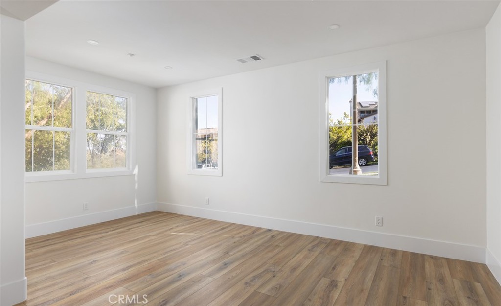 4158 Costero Risco San Clemente, CA 92673 - Photo 13 of 56 a view of an empty room with wooden floor and a window