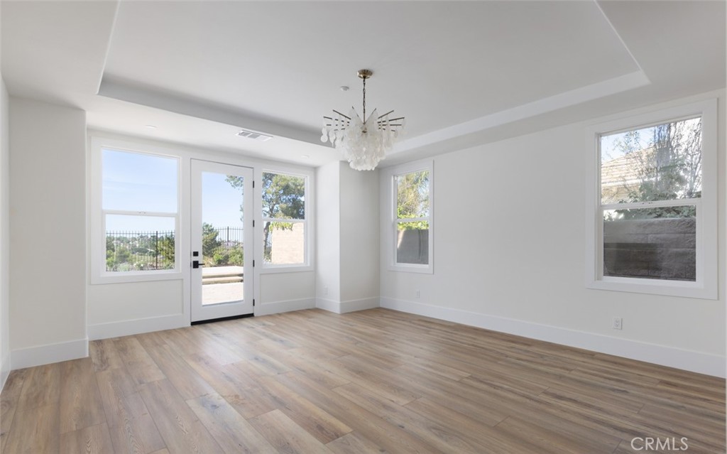 4158 Costero Risco San Clemente, CA 92673 - Photo 15 of 56 a view of empty room with wooden floor and fan