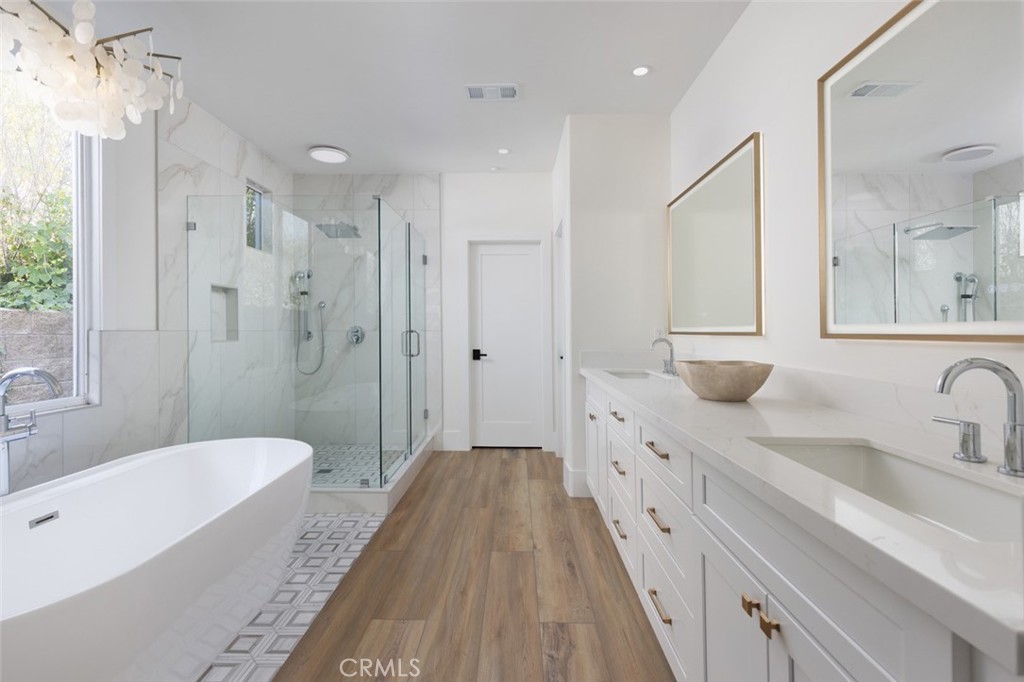 4158 Costero Risco San Clemente, CA 92673 - Photo 17 of 56 a spacious bathroom with a double vanity sink a mirror a shower and a bathtub