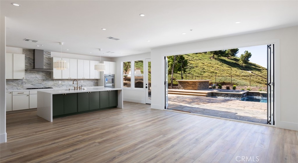 4158 Costero Risco San Clemente, CA 92673 - Photo 25 of 56 a large kitchen with a large window and cabinets