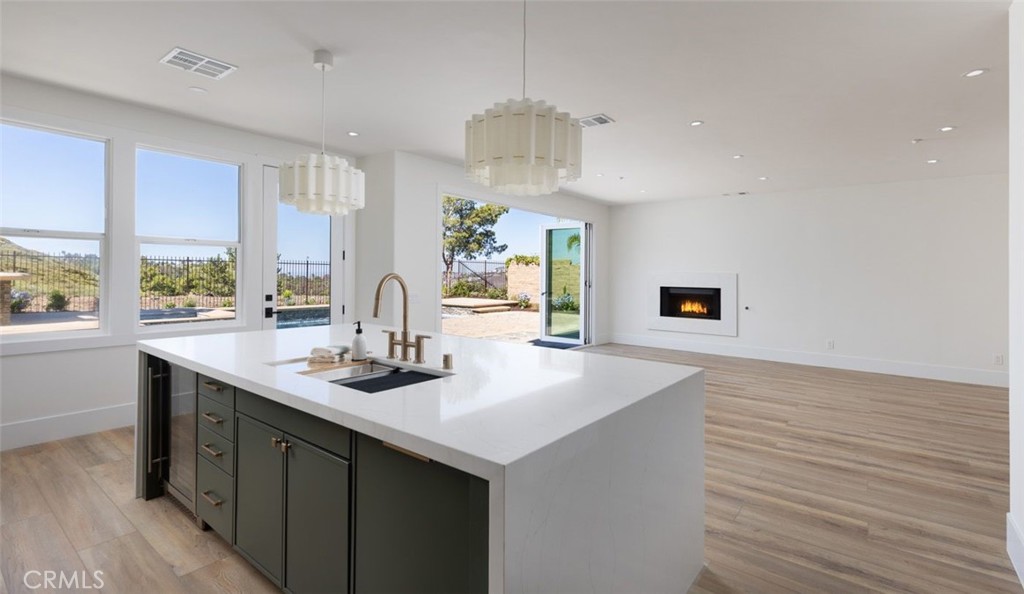 4158 Costero Risco San Clemente, CA 92673 - Photo 27 of 56 a kitchen with a sink and wooden cabinets