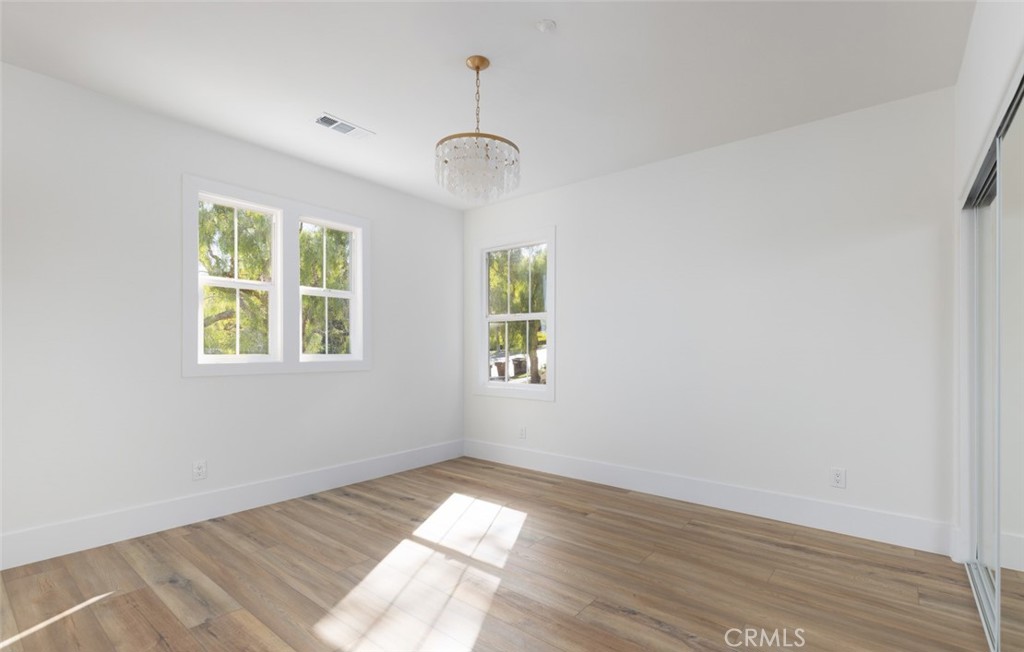 4158 Costero Risco San Clemente, CA 92673 - Photo 32 of 56 a view of an empty room with wooden floor and a window