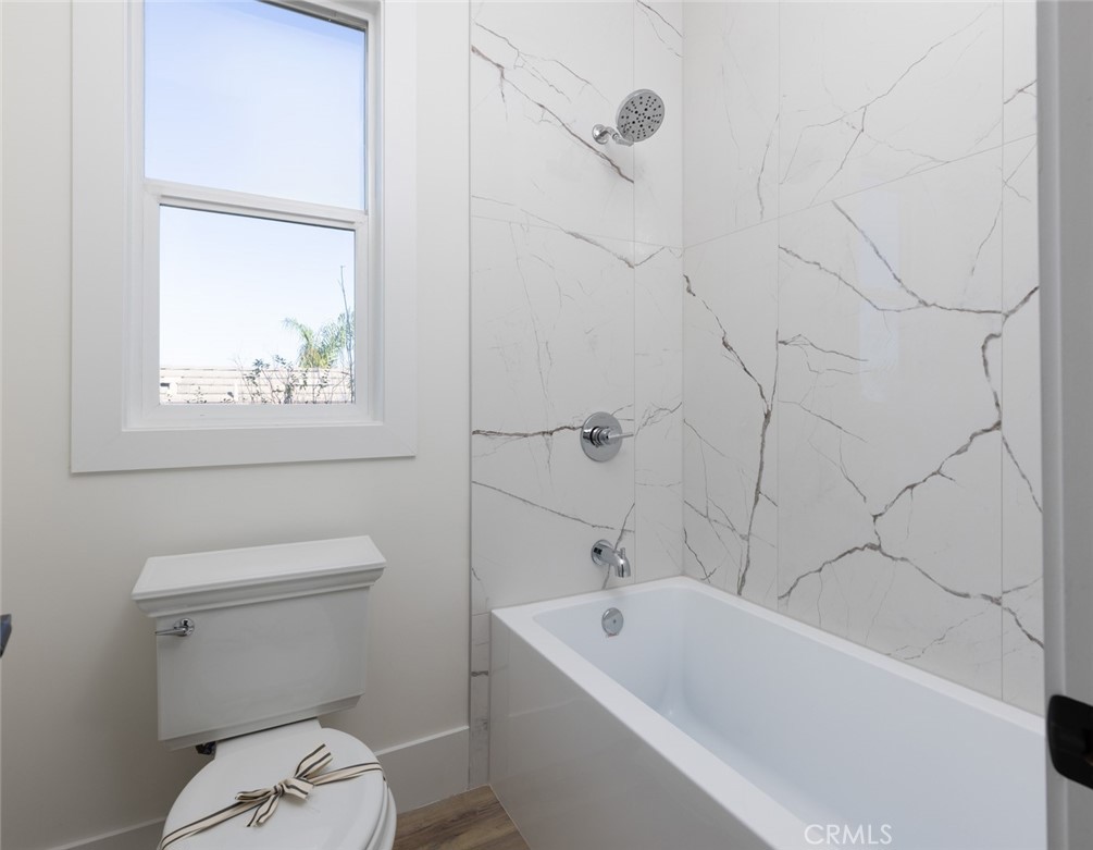 4158 Costero Risco San Clemente, CA 92673 - Photo 38 of 56 a white bath tub sitting next to a white toilet and a shower