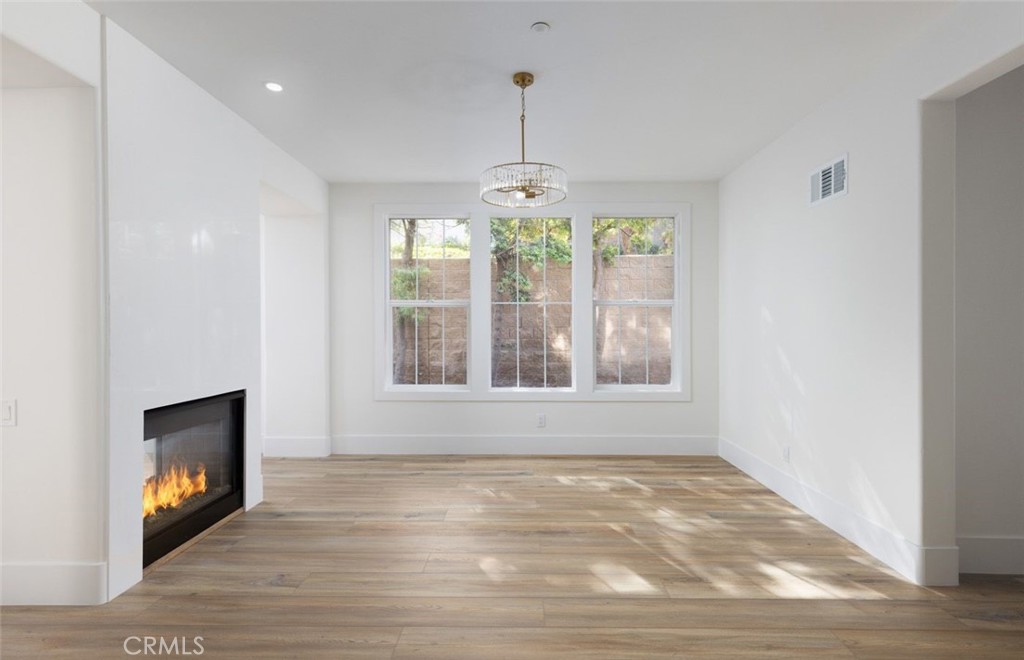 4158 Costero Risco San Clemente, CA 92673 - Photo 10 of 56 a view of an empty room with wooden floor and a window