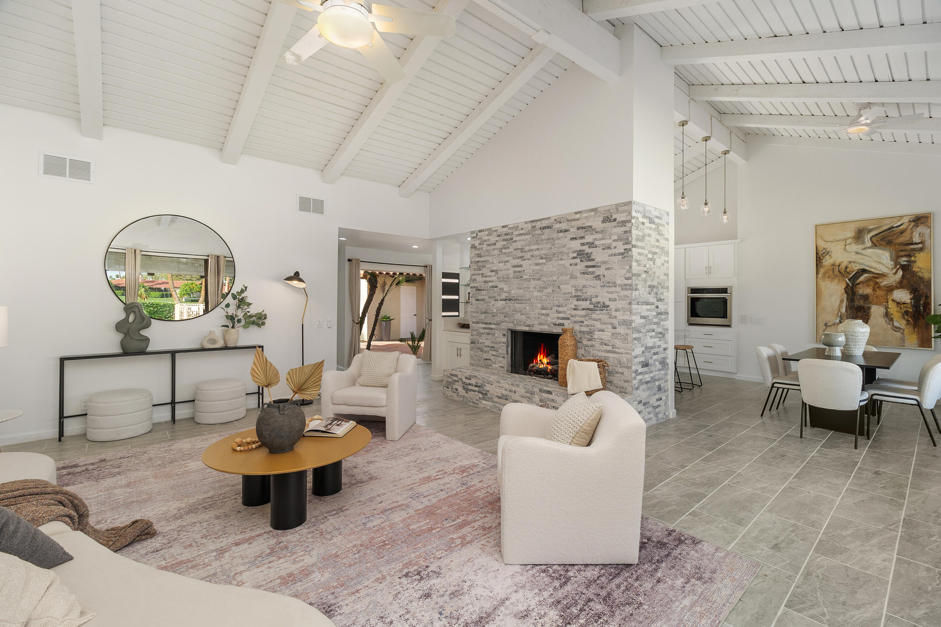 49835 Adelito Circle La Quinta, CA 92253 - Photo 1 of 36 a living room with furniture and a fireplace