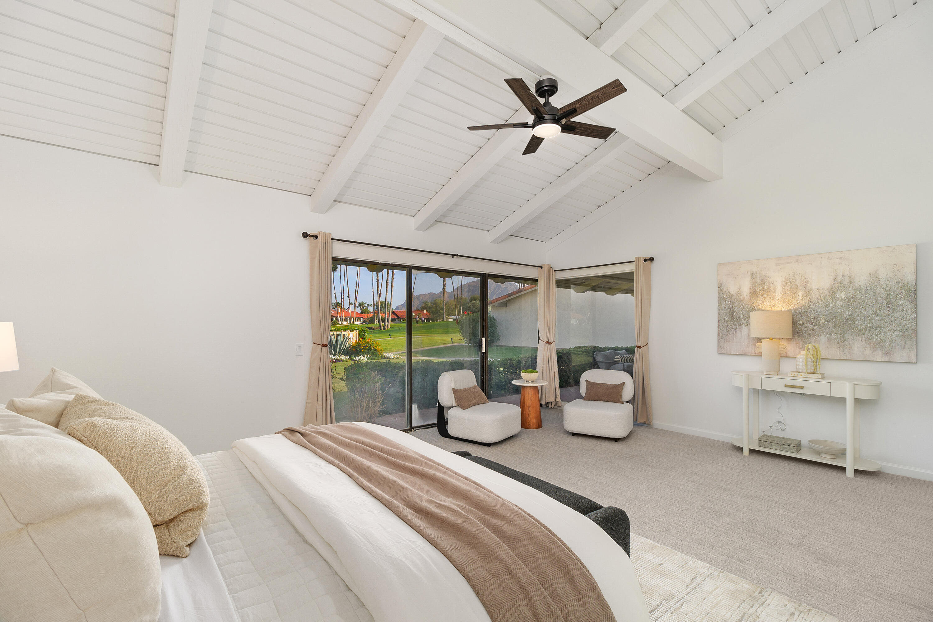 49835 Adelito Circle La Quinta, CA 92253 - Photo 13 of 36 a bedroom with a bed and large windows