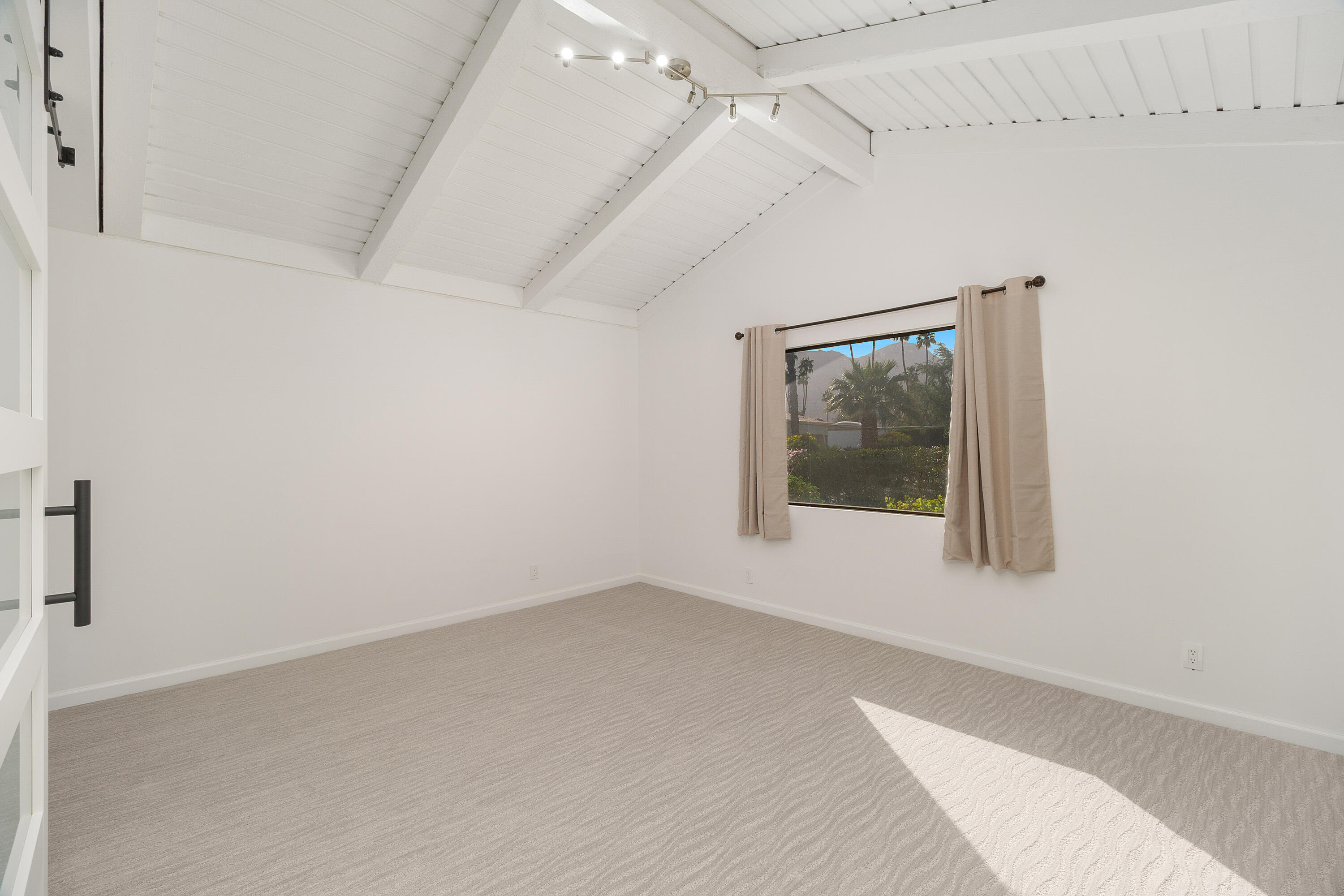 49835 Adelito Circle La Quinta, CA 92253 - Photo 18 of 36 an empty room with a window