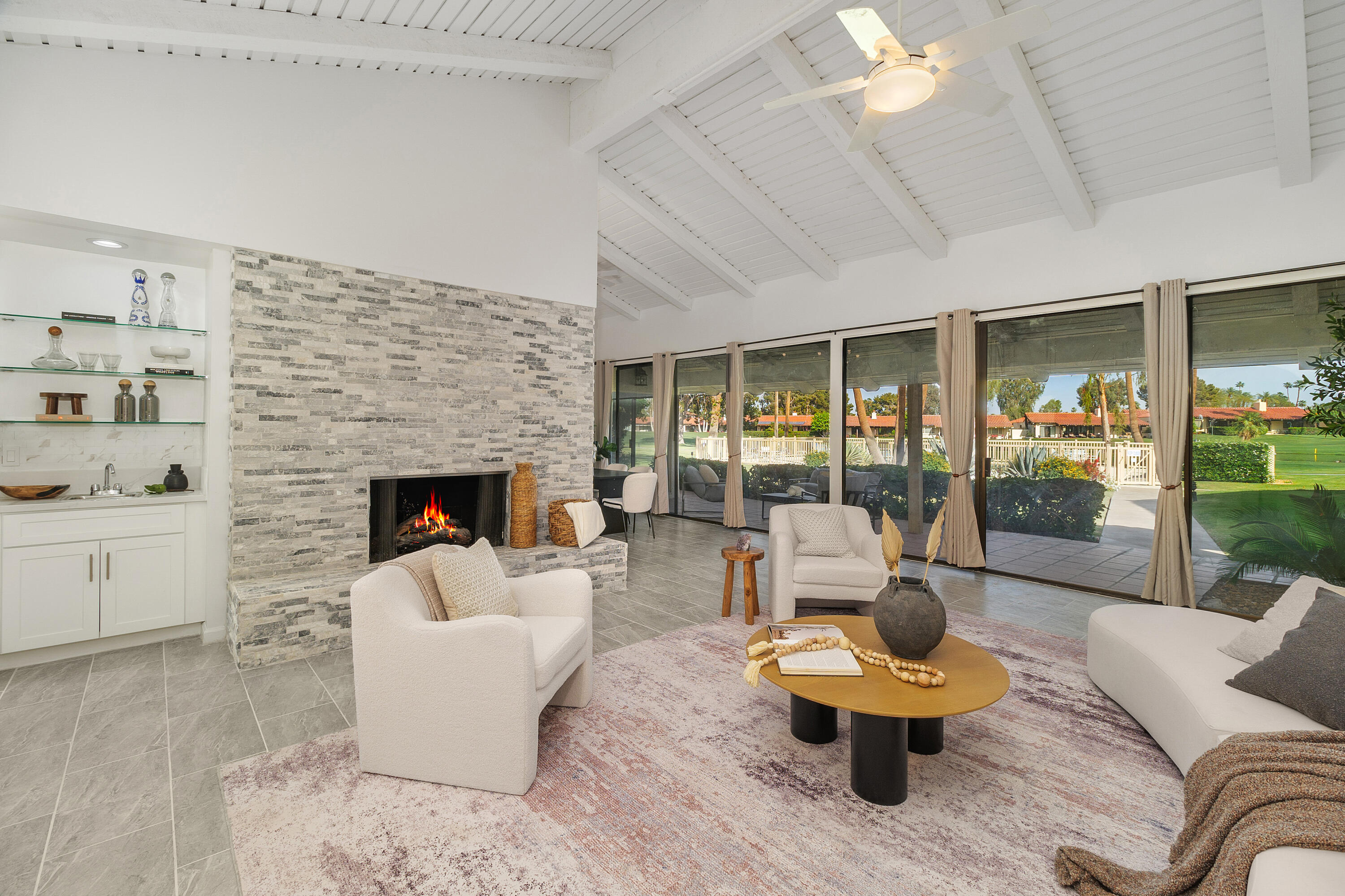 49835 Adelito Circle La Quinta, CA 92253 - Photo 2 of 36 a living room with furniture and a fireplace