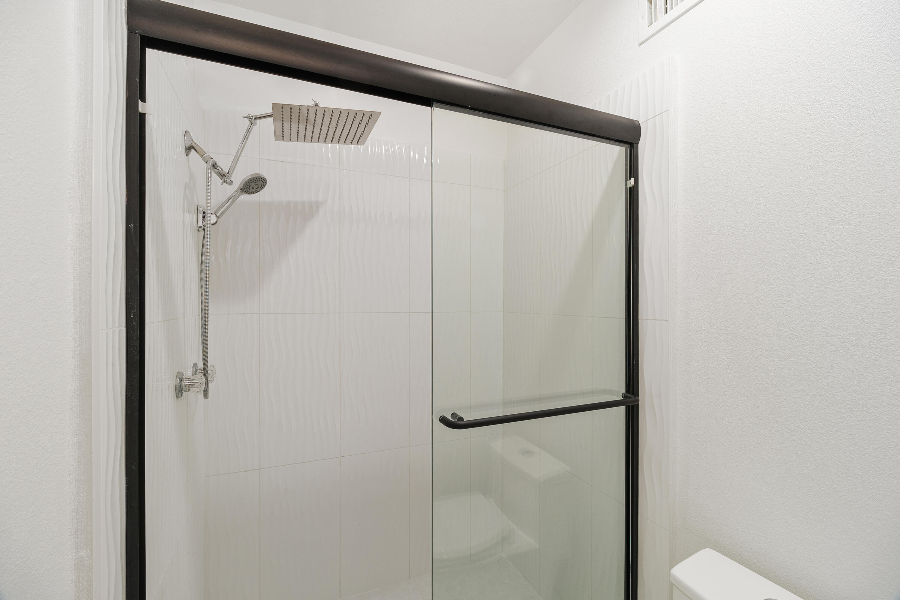 49835 Adelito Circle La Quinta, CA 92253 - Photo 24 of 36 a bathroom with a glass shower door