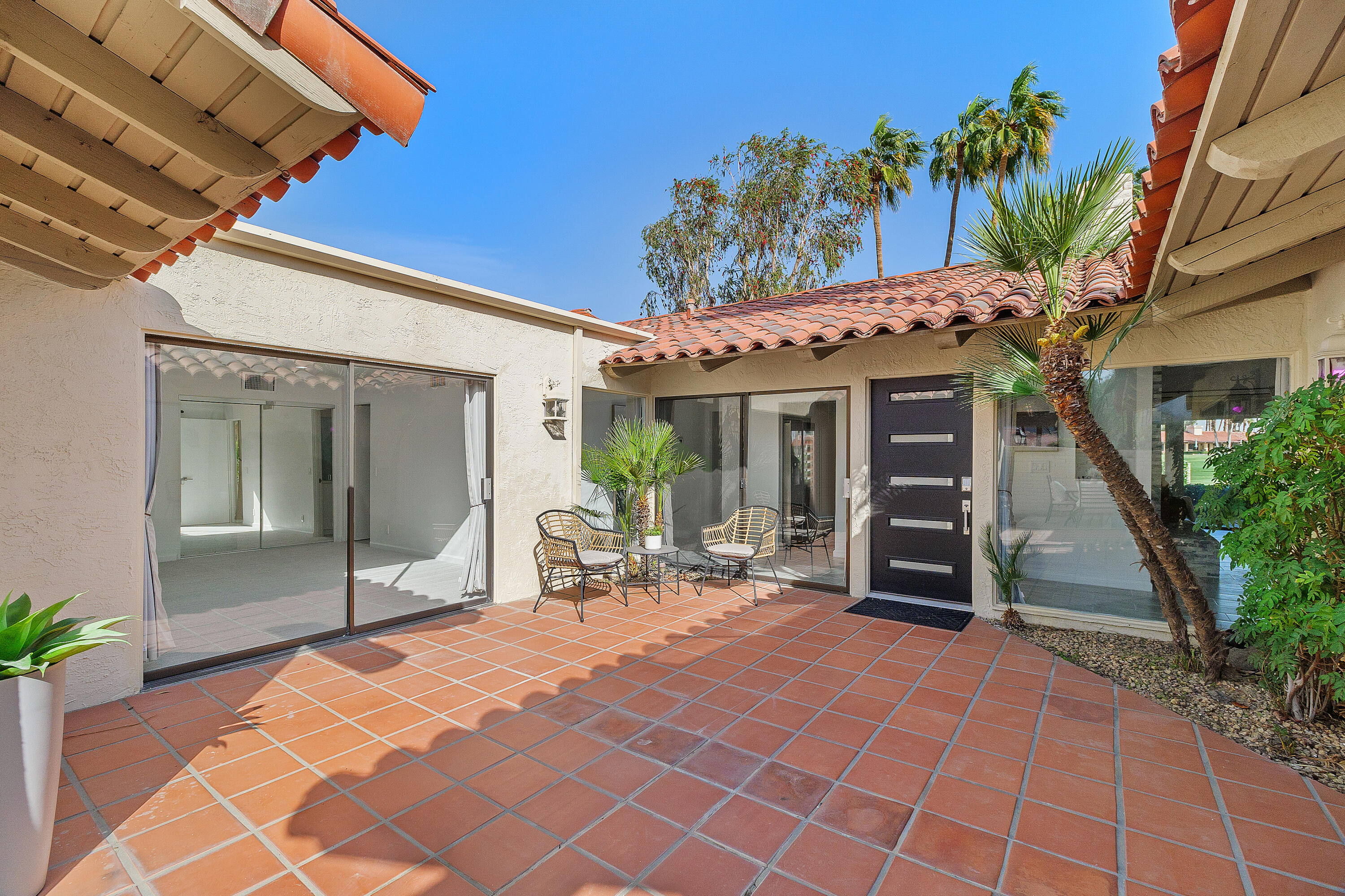 49835 Adelito Circle La Quinta, CA 92253 - Photo 29 of 36 a view of a chair and table in backyard of the house