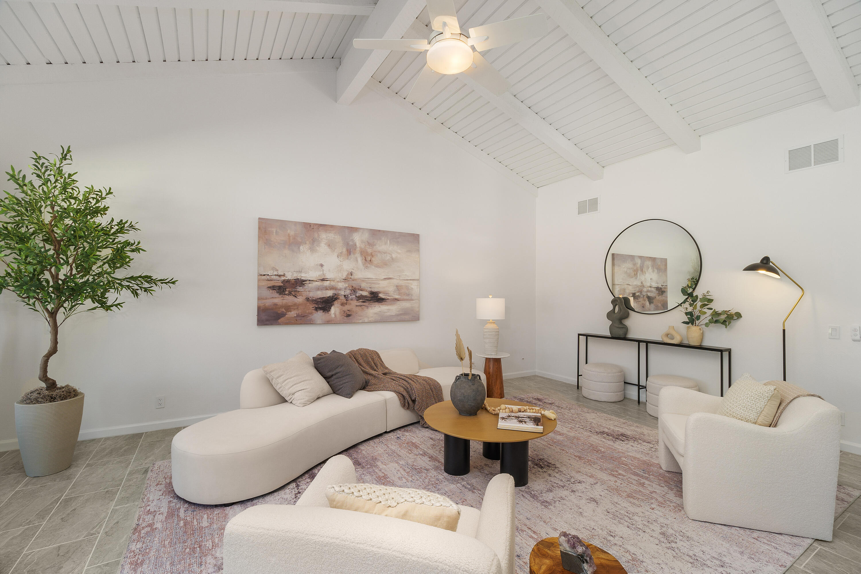 49835 Adelito Circle La Quinta, CA 92253 - Photo 3 of 36 a living room with furniture a potted plant and a lamp