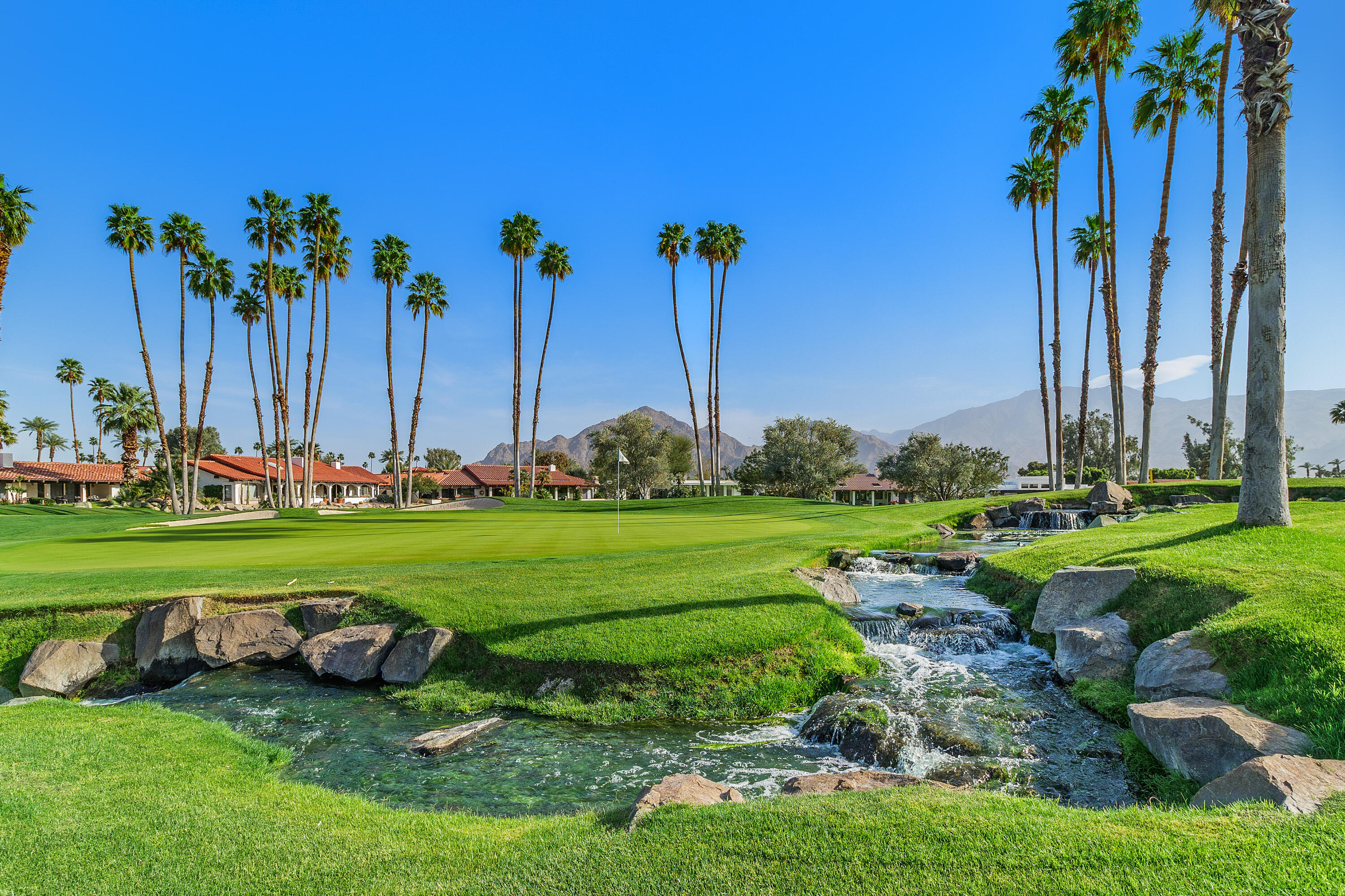 49835 Adelito Circle La Quinta, CA 92253 - Photo 34 of 36 a view of a table and chairs in the garden