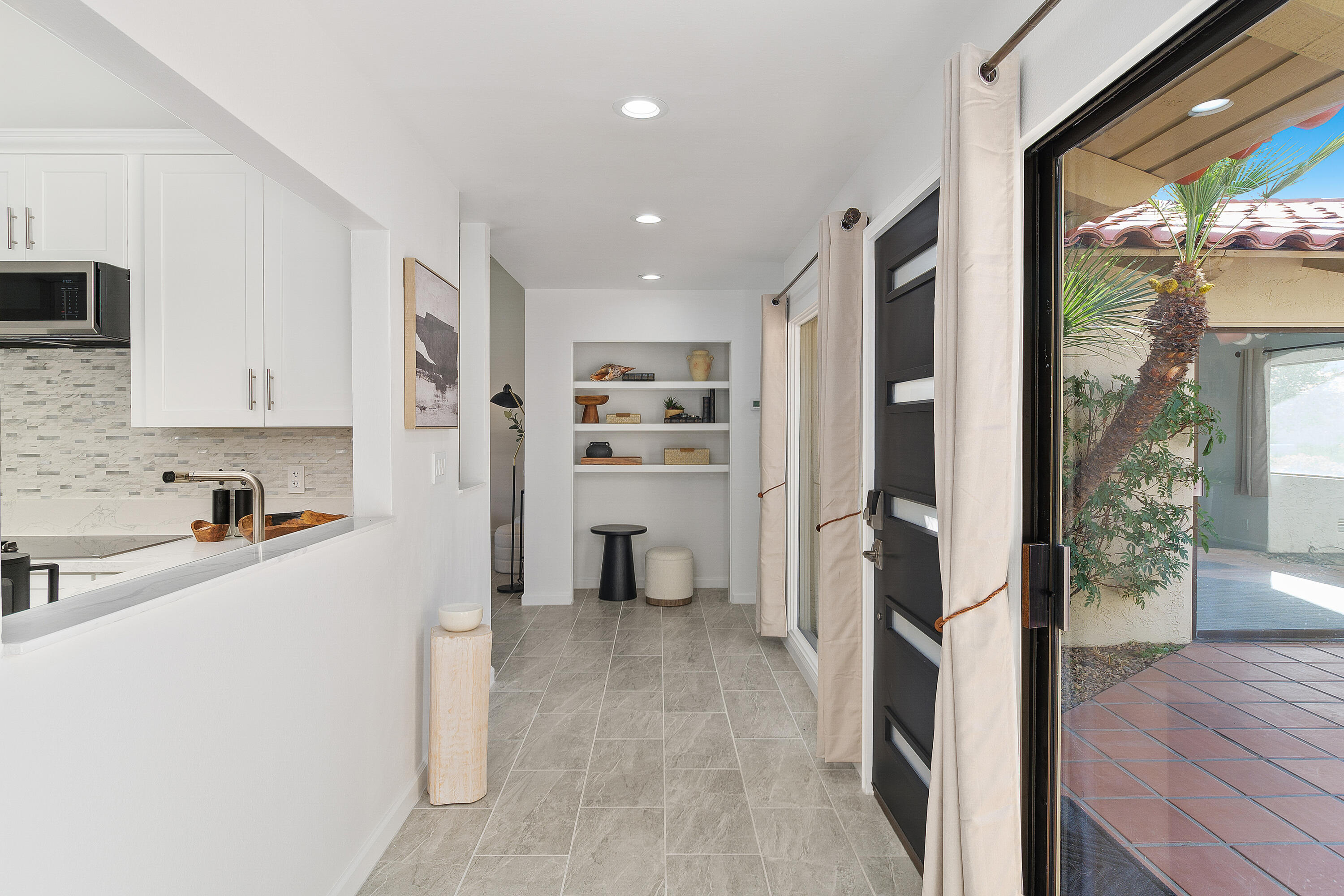 49835 Adelito Circle La Quinta, CA 92253 - Photo 10 of 36 a view of a kitchen with refrigerator and wooden floor