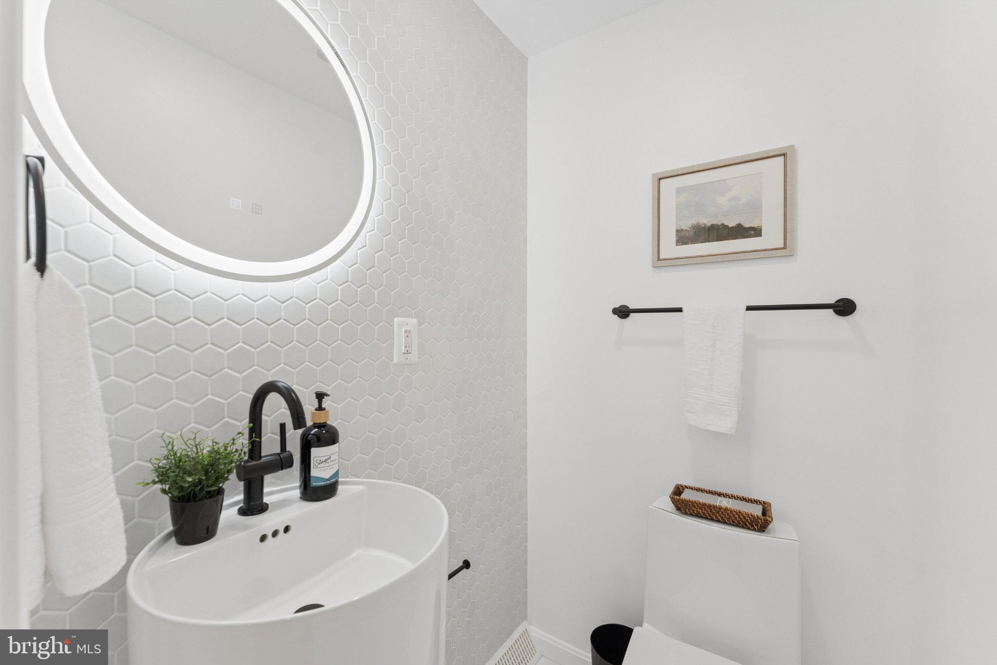3219 Fox Mill Road Oakton, VA 22124 - Photo 27 of 87 Sleek modern bathroom with chic accents.
