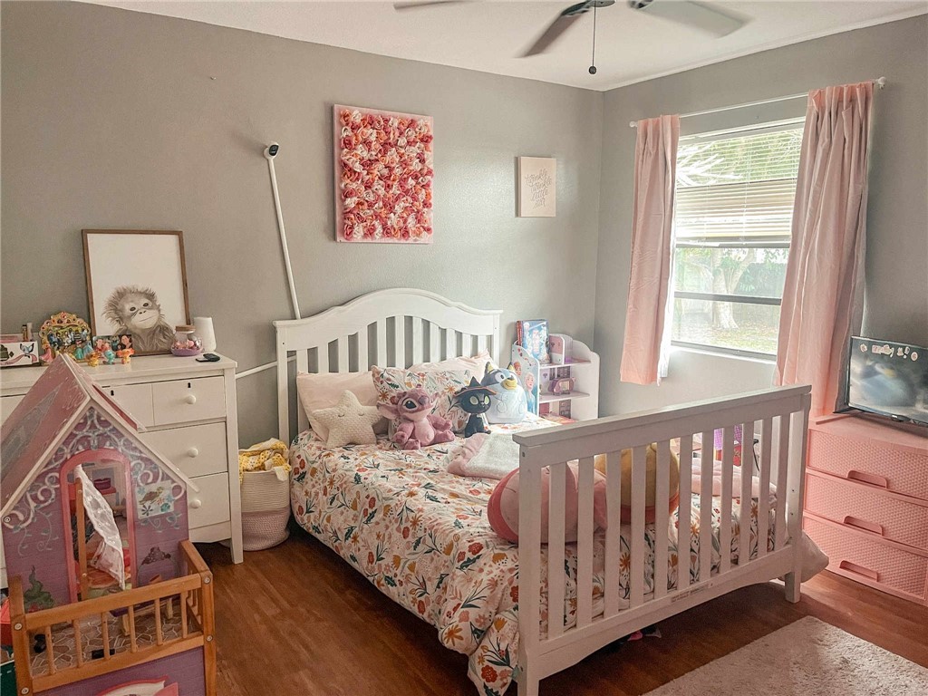 655 Chesser Avenue Sebastian, FL 32958 - Photo 12 of 17 a bedroom with a bed and window