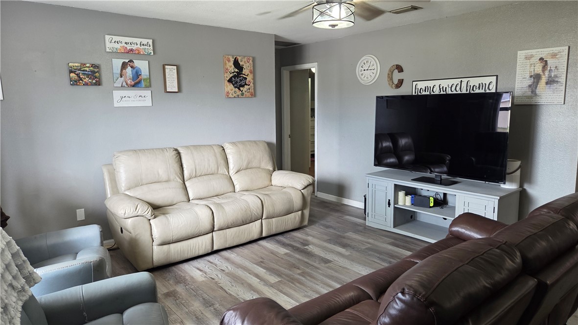 655 Chesser Avenue Sebastian, FL 32958 - Photo 2 of 17 a living room with furniture and a flat screen tv