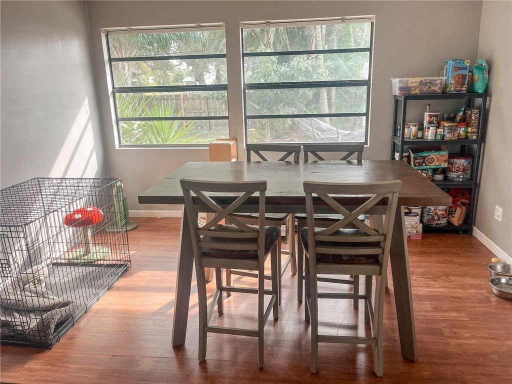 655 Chesser Avenue Sebastian, FL 32958 - Photo 5 of 17 a view of a dining room with furniture and wooden floor