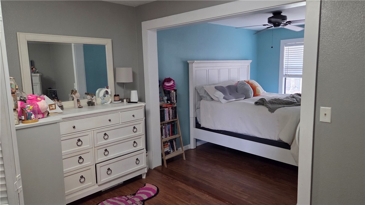655 Chesser Avenue Sebastian, FL 32958 - Photo 6 of 17 a bedroom with a bed and wooden floor