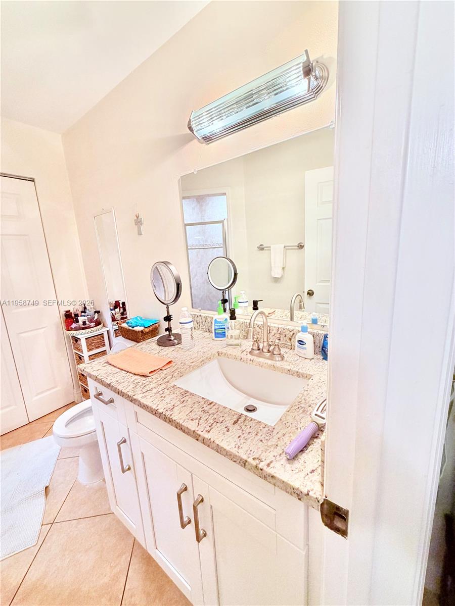 3370 Beau Rivage Drive, Unit 4Q Pompano Beach, FL 33064 - Photo 11 of 31 a bathroom with a sink and a mirror