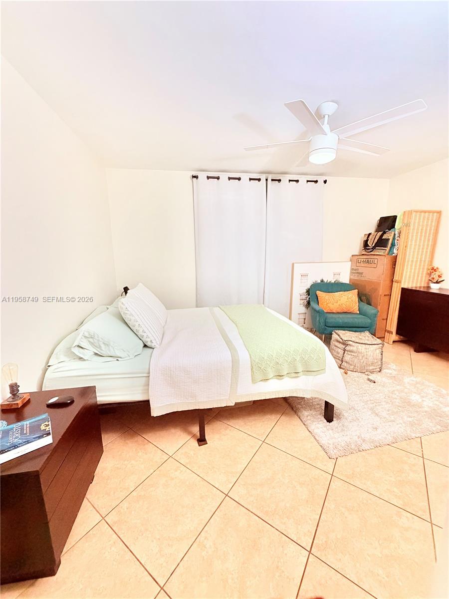 3370 Beau Rivage Drive, Unit 4Q Pompano Beach, FL 33064 - Photo 13 of 31 a bedroom with a bed and a cabinets