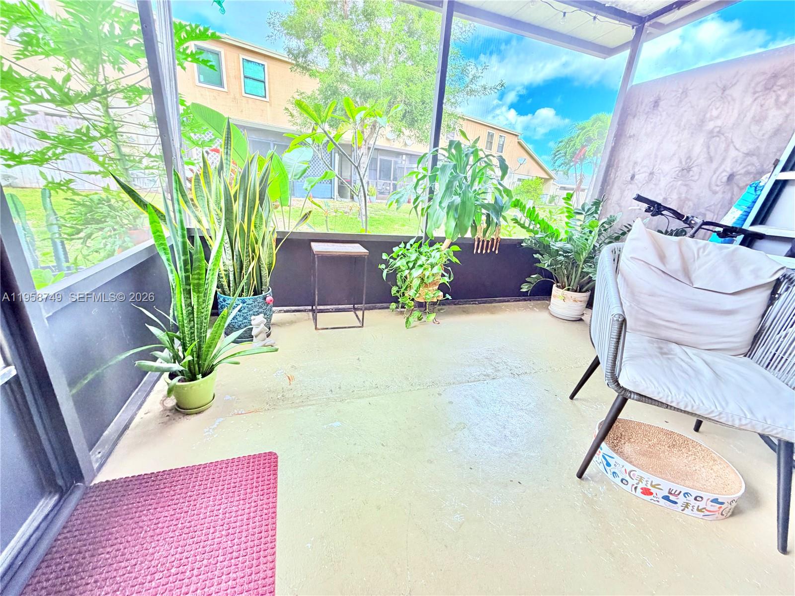 3370 Beau Rivage Drive, Unit 4Q Pompano Beach, FL 33064 - Photo 21 of 31 a potted plant sitting in front of a building