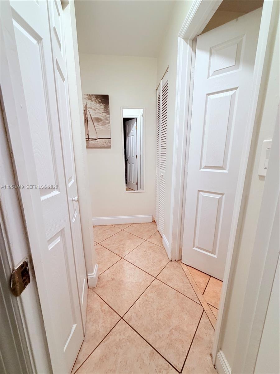 3370 Beau Rivage Drive, Unit 4Q Pompano Beach, FL 33064 - Photo 5 of 31 a view of a hallway