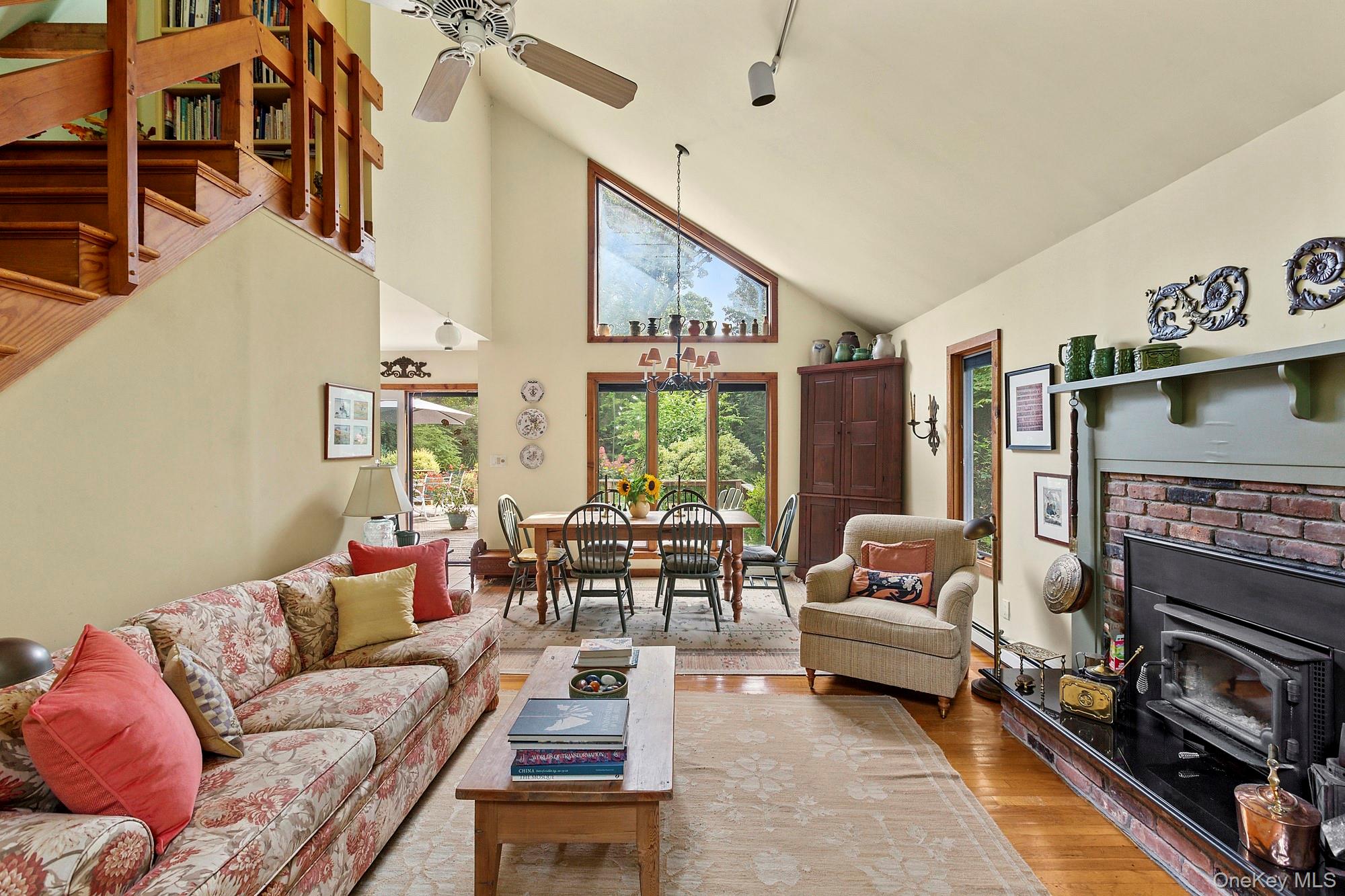 4528 Noyack Road Sag Harbor, NY 11963 - Photo 3 of 13 a living room with furniture and a fireplace