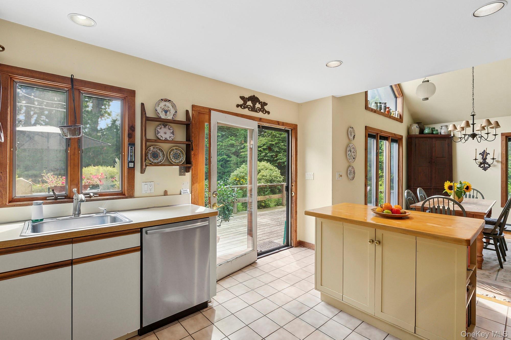 4528 Noyack Road Sag Harbor, NY 11963 - Photo 6 of 13 a kitchen with a sink and large window
