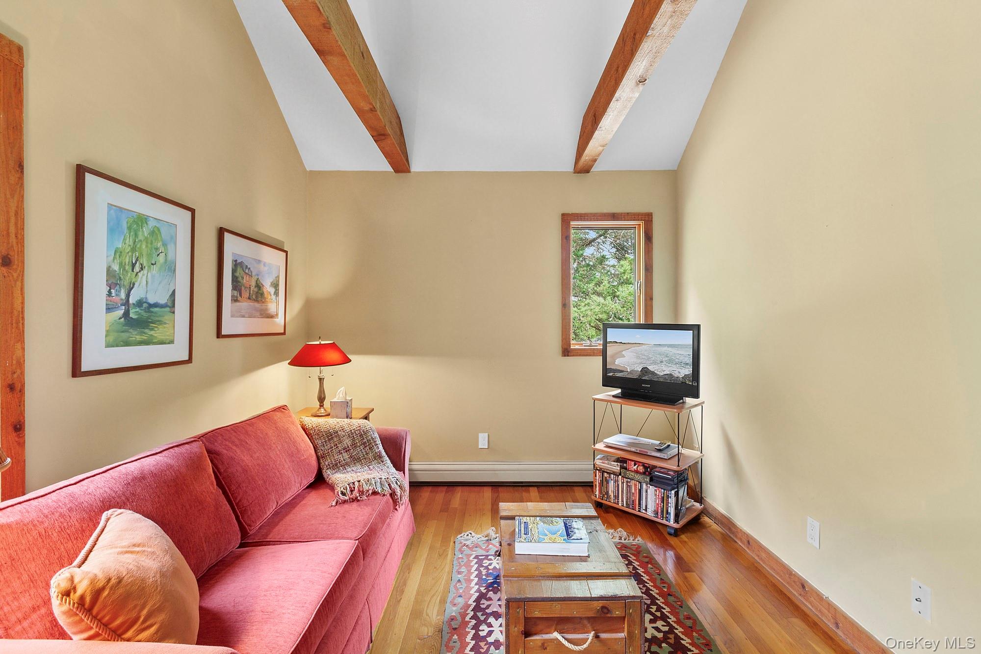 4528 Noyack Road Sag Harbor, NY 11963 - Photo 9 of 13 a bedroom with furniture and a window