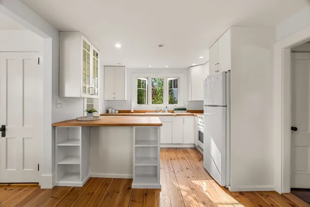 a kitchen with counter top space and center island