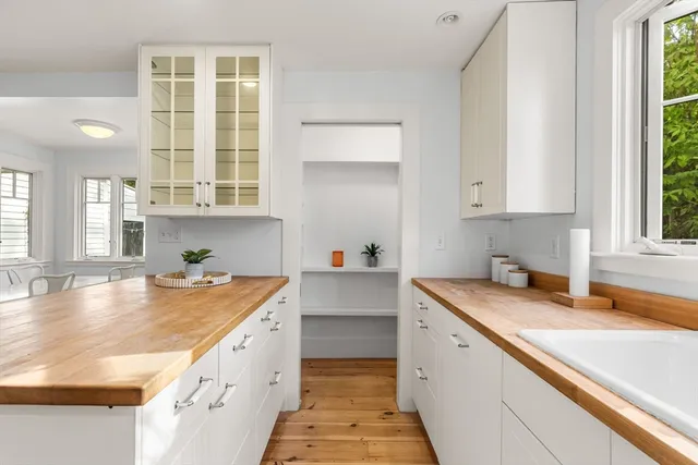 a kitchen with a sink stove and cabinets