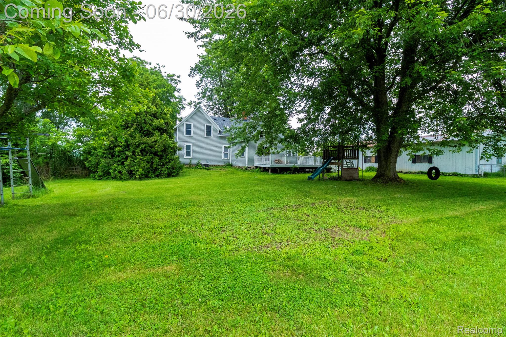 8150 Norman Road Imlay City, MI 48444 - Photo 42 of 58 Expansive green lawn with mature trees providing ample shade