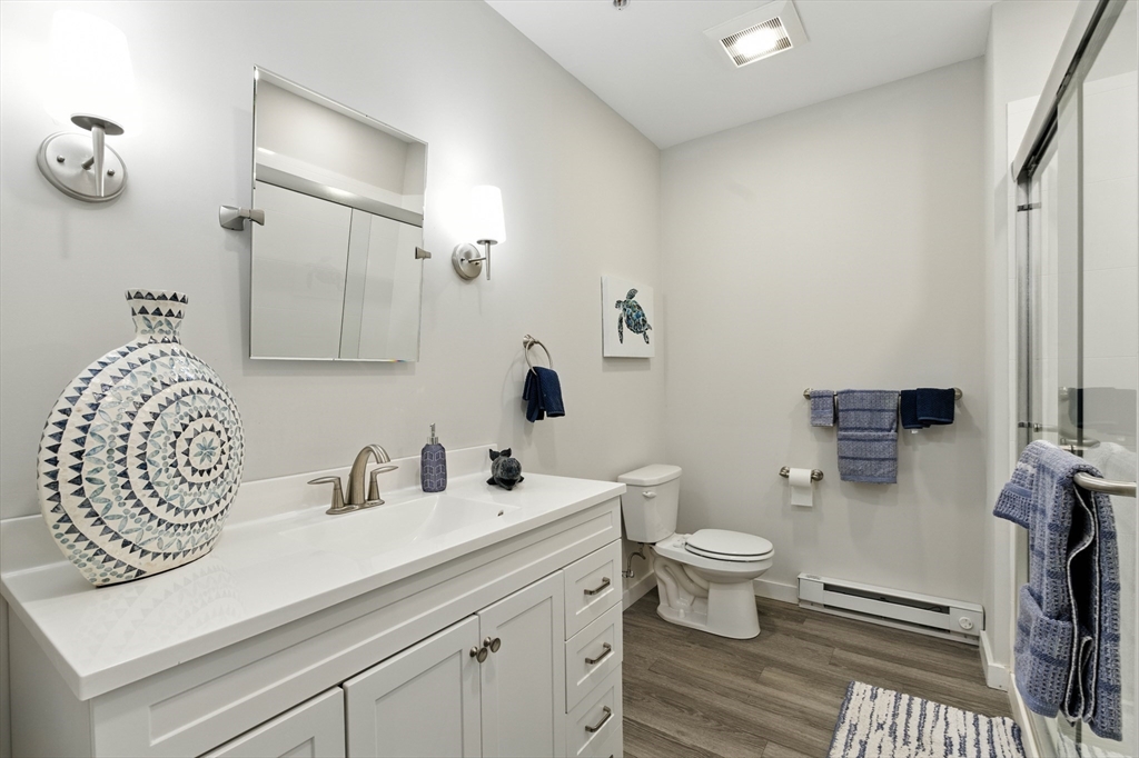 55 Sterling Street, Unit 314 Clinton, MA 01510 - Photo 16 of 36 a bathroom with a sink a toilet and a mirror