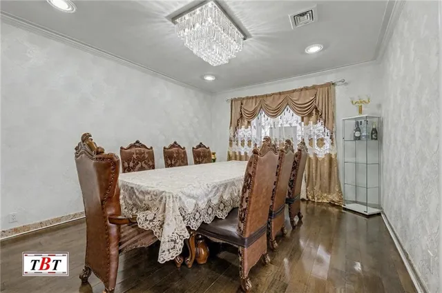 a large kitchen with a large counter top appliances and cabinets