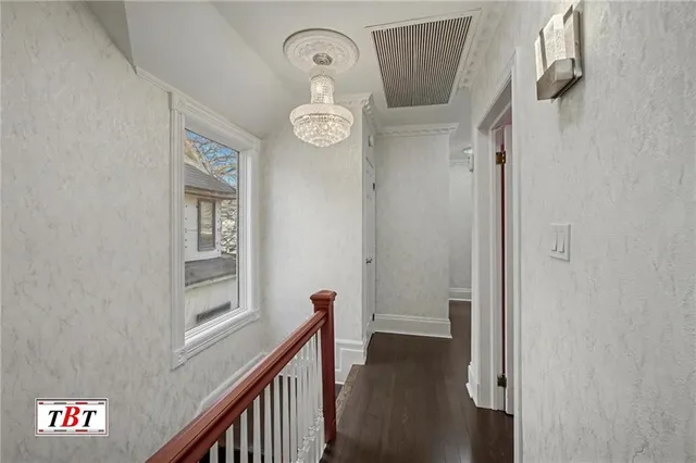 a spacious bedroom with a bed and a large window