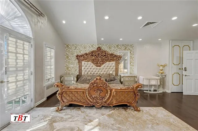 a bedroom with a bed and a view of bathroom