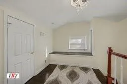 a view of a hallway with windows