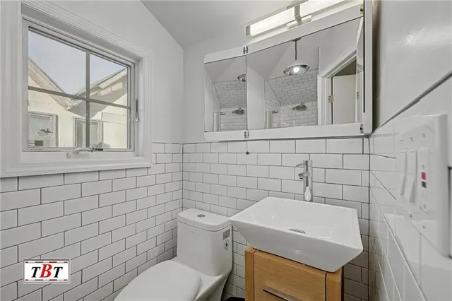 a view of a hallway to a bedroom with stairs