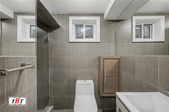 a view of a house with a patio and backyard