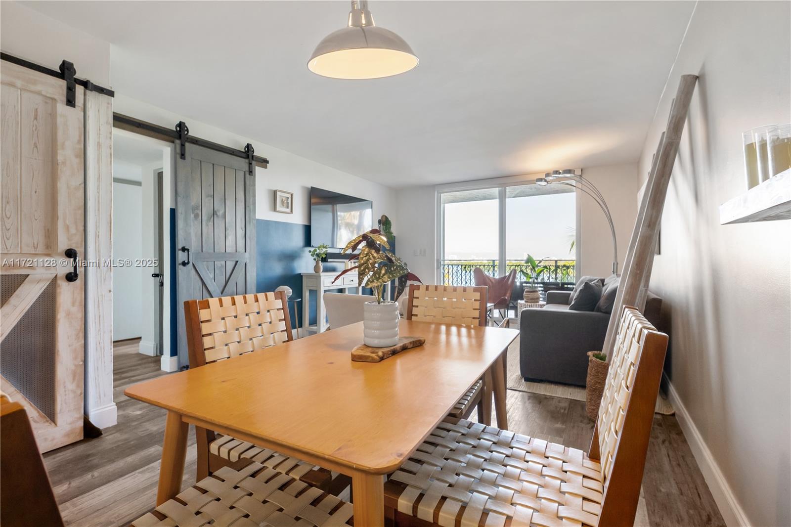 750 Northeast 64th Street, Unit B504 Miami, FL 33138 - Photo 13 of 37 a view of a dining room with furniture