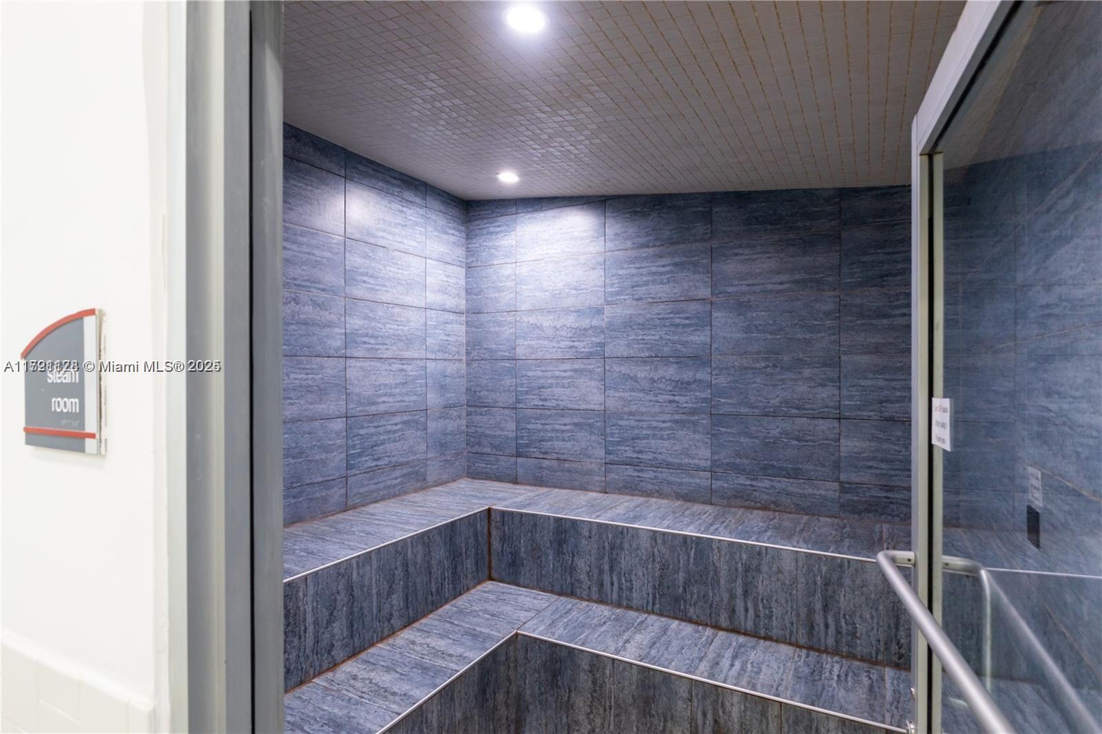 750 Northeast 64th Street, Unit B504 Miami, FL 33138 - Photo 29 of 37 a bathroom with a shower