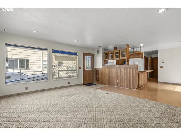 a view of an empty room with a window