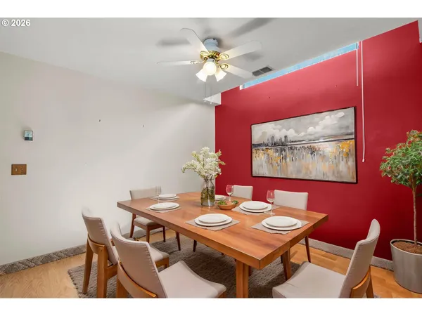 a dining room with furniture and chandelier
