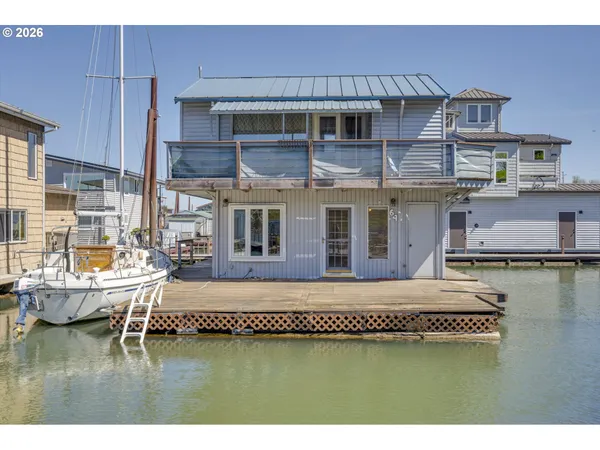 a swimming pool view with a outdoor seating space